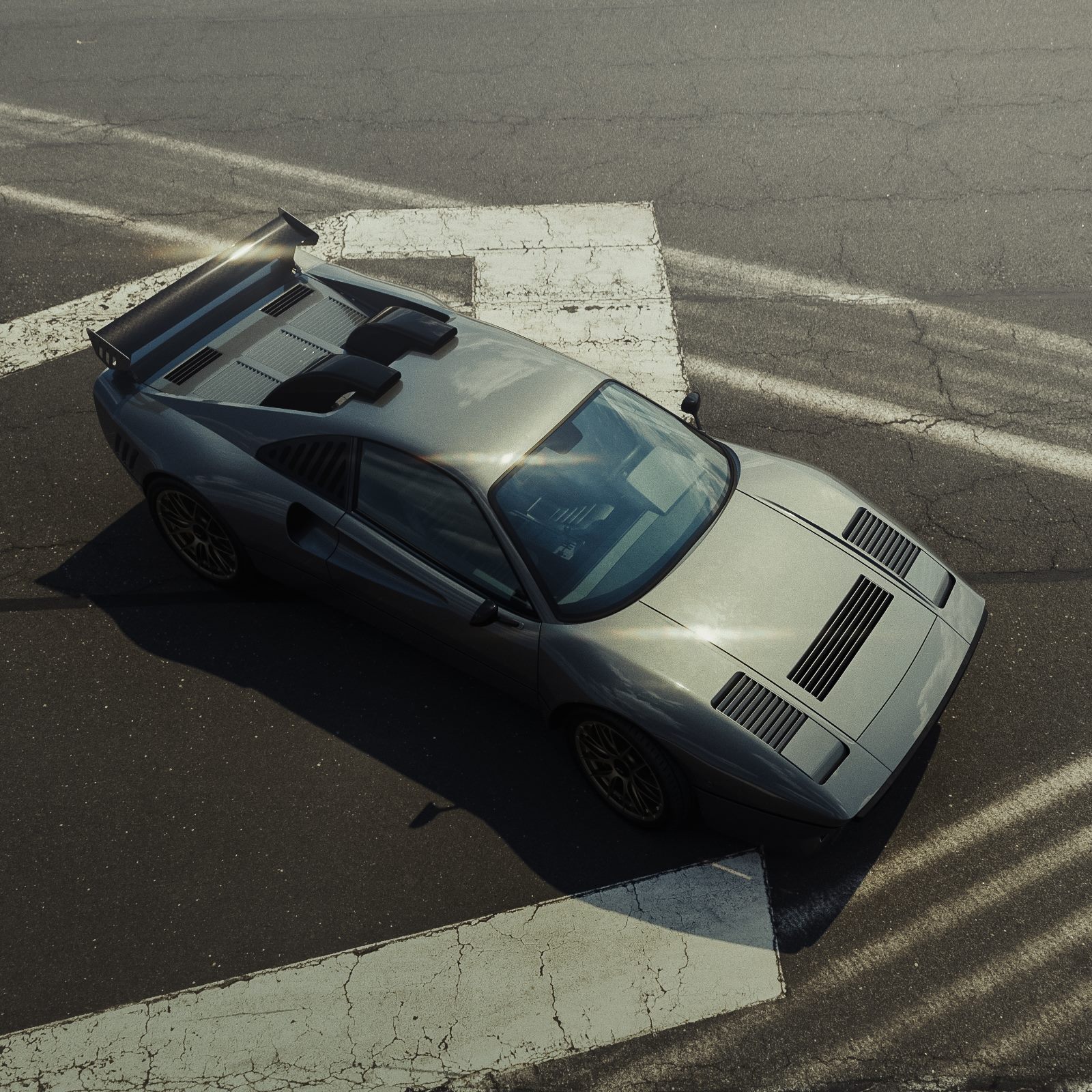 288 GTO from above on asphalt with white road markings and long shadows