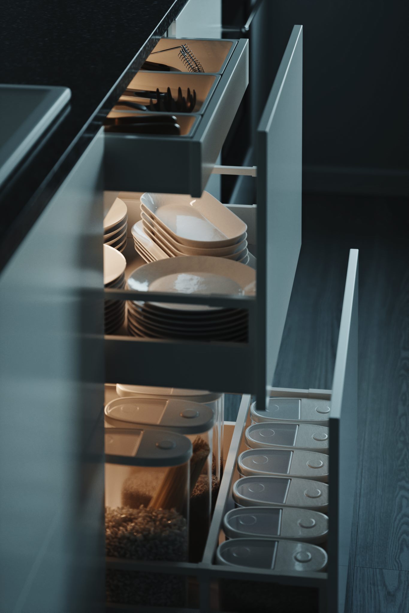 Open kitchen drawers holding plates and bowls in dim light