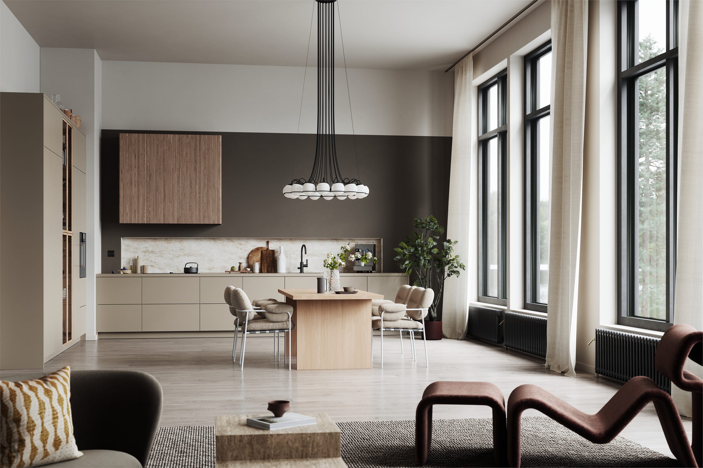 Open-plan room with a kitchen, tall windows, a pendant light and lounge chairs