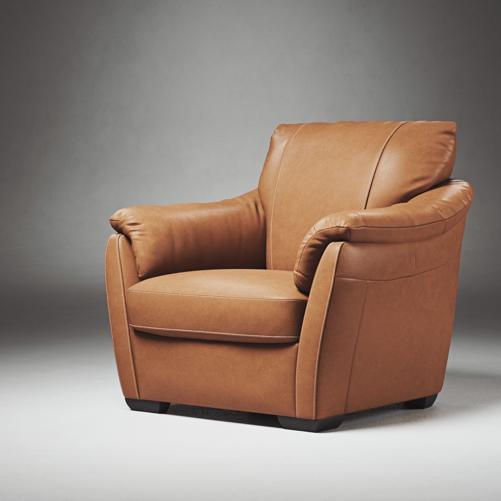 Brown leather armchair in a grey studio