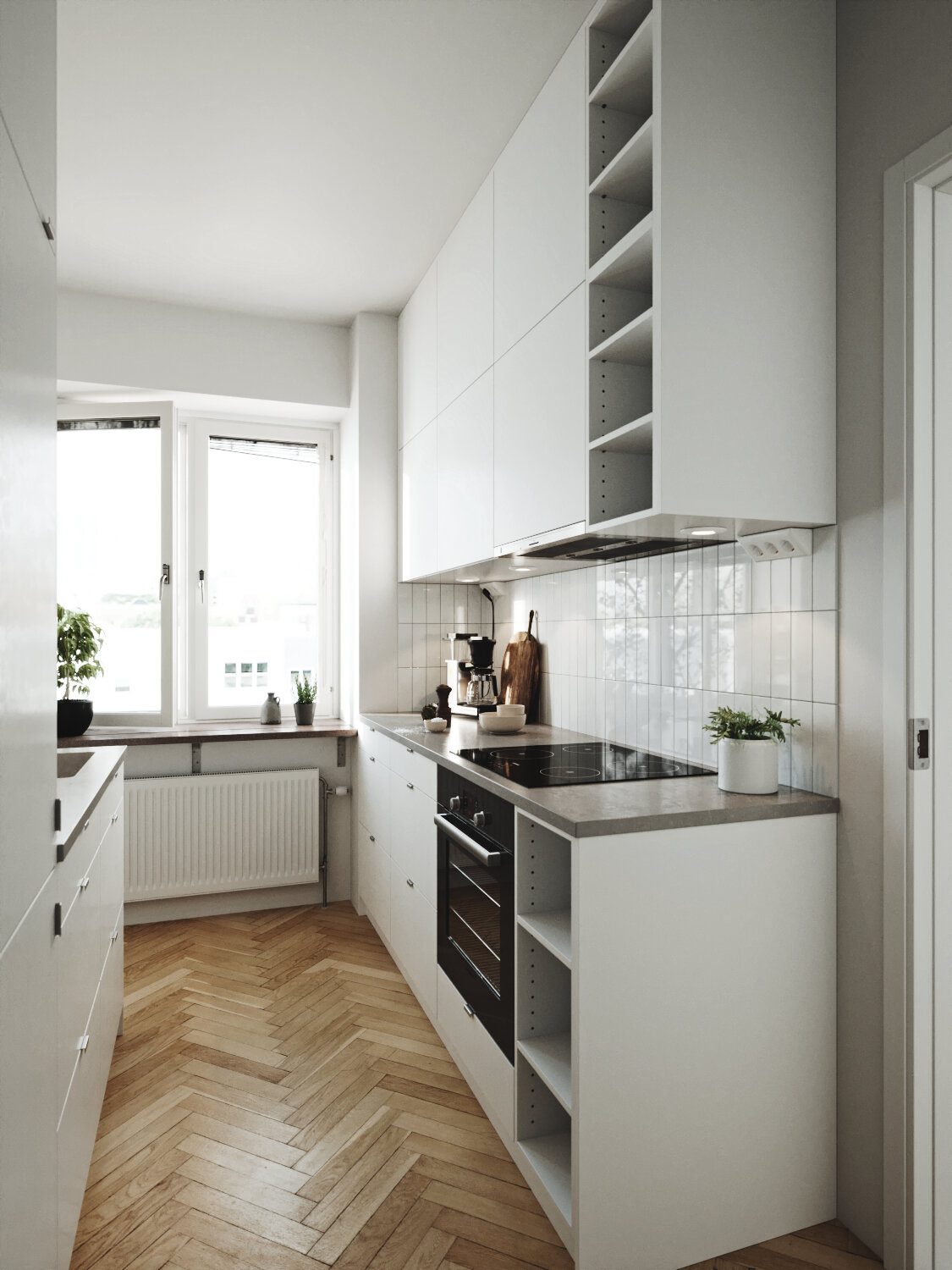 White kitchen with a herringbone wood floor